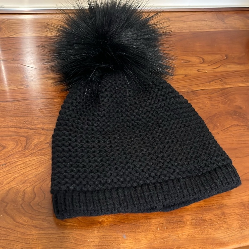 Black knit winter hat with fur pompom